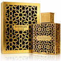 Gold 'Rayhaan Elixir' packaging with intricate patterns on a white background